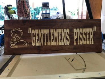 Sign made as special order for a man cave toilet