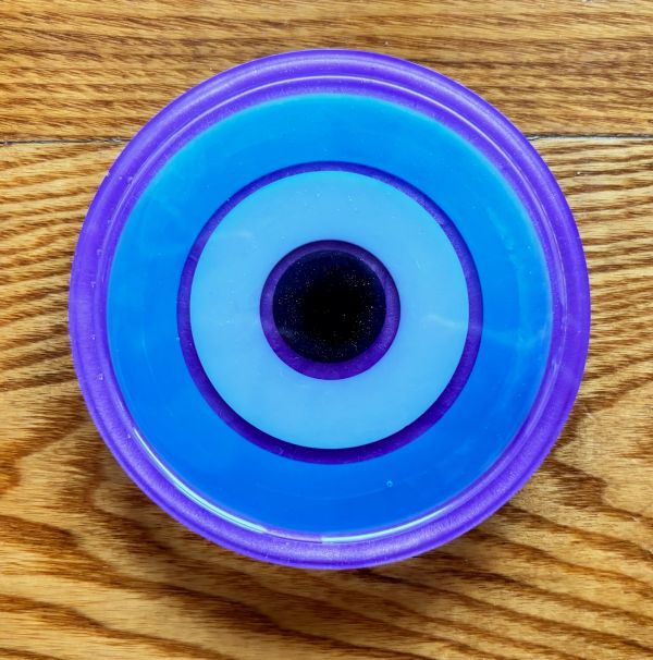 Close-up of a blue and purple circular object resembling an eye.