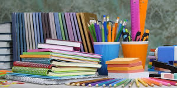 A colorful assortment of school supplies including notebooks, pencils, and rulers.
