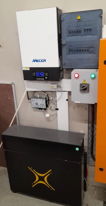 Electrical equipment setup with Mecer inverter and battery system.