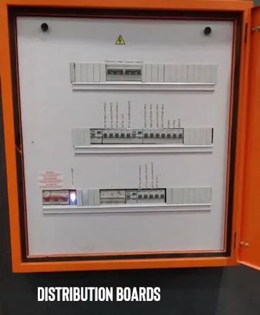 Electric distribution board with circuit breakers inside an orange frame.