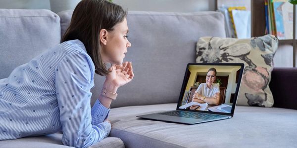 Therapist engaging in a compassionate discussion with a client