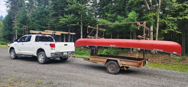 Transportation for you by truck and canoe trailer.