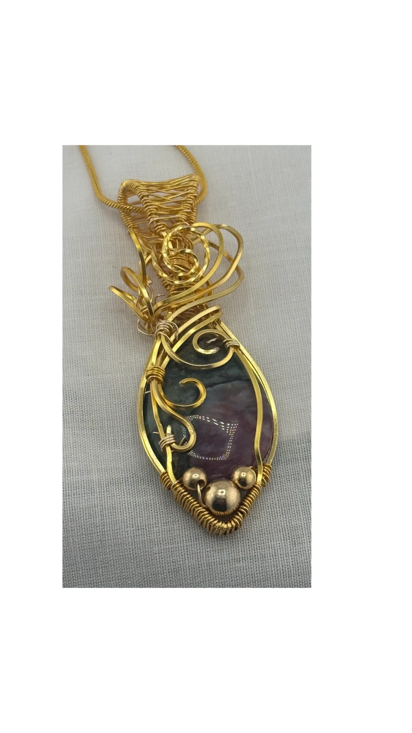 Ruby in Choroisite wire wrapped in gold plated copper with gold beads. 