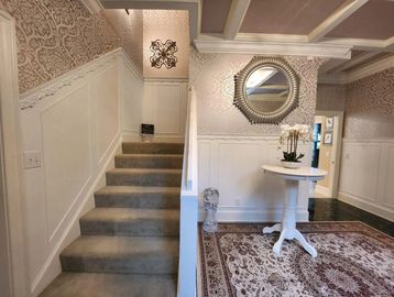 What is the first statement your home makes? They say first impressions are lasting and you never get a second chance to make one. Foyers are often overlooked but updating your home's entry way with custom carpentry, coffered ceilings. ornamental ceilings, light fixtures, gorgeous wallpaper that reflects your own style, wainscotting or judge's panel, crown moldings, chandeliers, custom double-doors with glass and wroghtiron, or any other refined touches that reflect your taste, can make a swoon-worthy impression every time someone enters your home.
