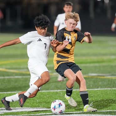 Lucas Engaging Baker Opponent for Ball
