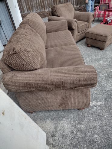 Brown corduroy sofa set on concrete floor.