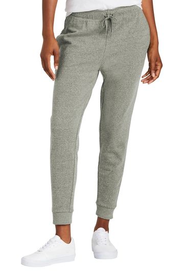 Person wearing gray jogger pants and white sneakers.