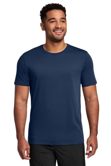 Smiling man wearing a plain navy blue t-shirt and black pants.