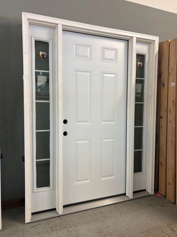 White door with side windows in a showroom.