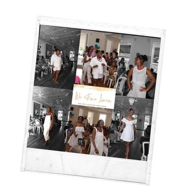 Fashion show featuring women in white dresses walking a runway indoors.