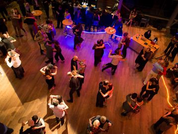 Couples of Tango dancers in a social dance party