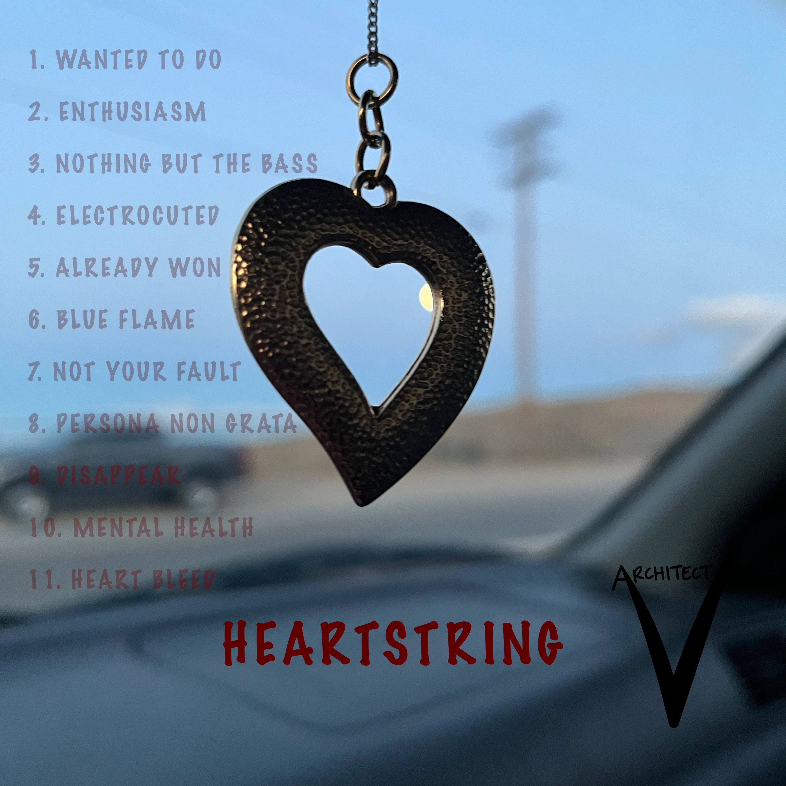 Heart-shaped pendant with a list of song titles against a blue sky.