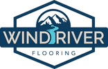 Logo for Wind River Flooring featuring mountains and a river.