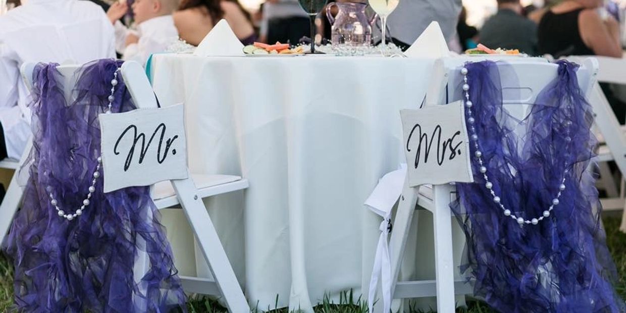 Wedding table with chairs labeled Mr. and Mrs.