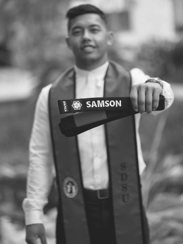 A serene landscape featuring a sunset over mountains with a calm lake reflecting the sky.