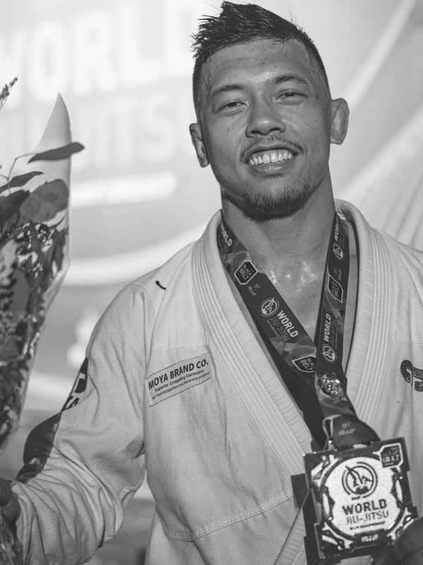 A scenic view of mountains and a lake under a clear blue sky.