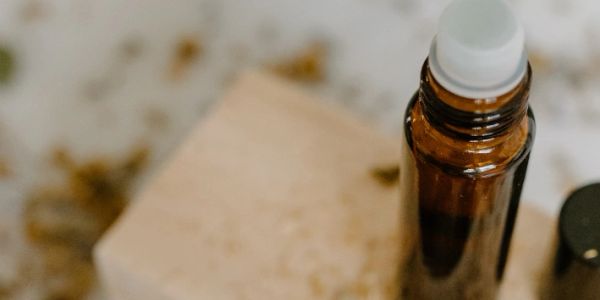 Close-up of a dropper bottle and soap bar.