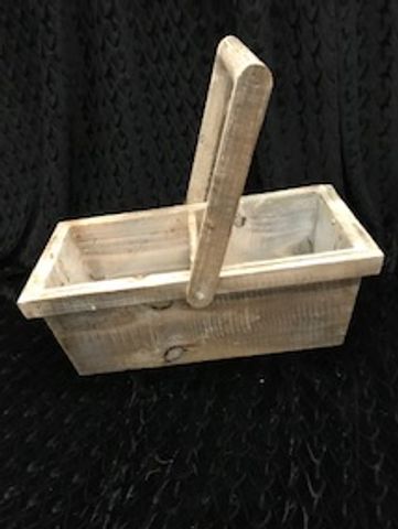Rustic wooden basket with a handle.