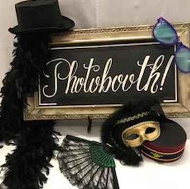 Photobooth sign with costume props.