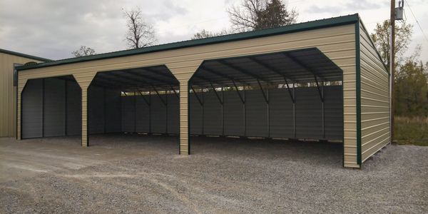 custom lean to brown and green metal three bay garage