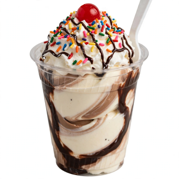 Chocolate and vanilla ice cream sundae with whipped cream and cherry.
