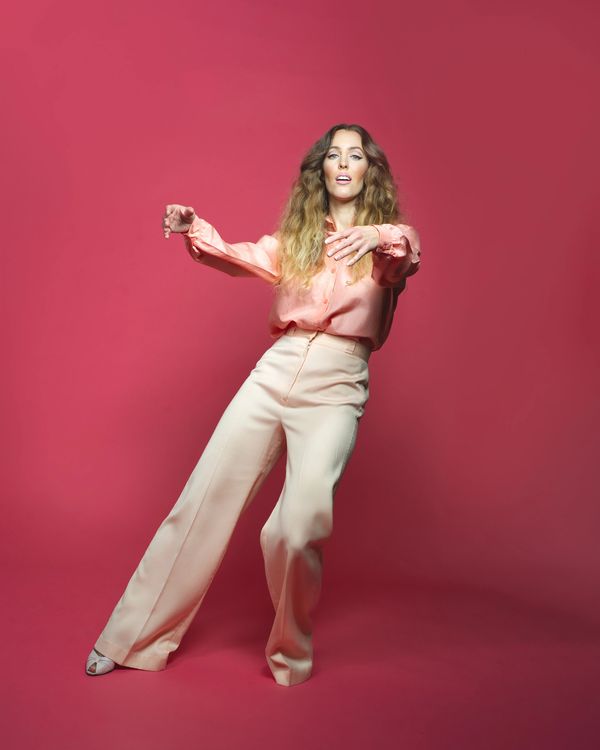 marie-clo in pink over red background