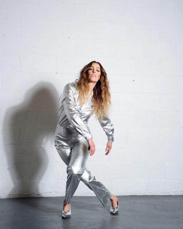 marie-clo outfit in silver over white brick background
