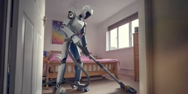 Robot vacuuming a bedroom.