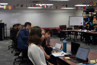 Group of students attentively working in a classroom.