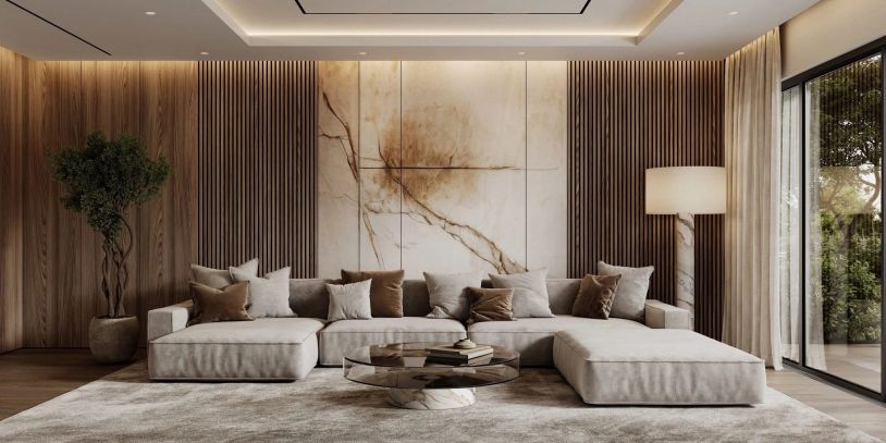 Modernt vardagsrum med beige soffa och marmorbord.
