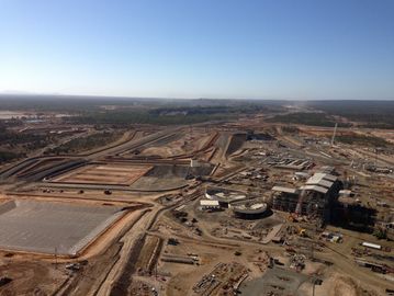 A large construction site under a clear sky.