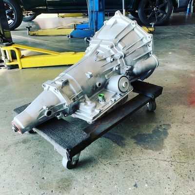 A car transmission on a wheeled platform in a workshop. Van Nuys transmission services