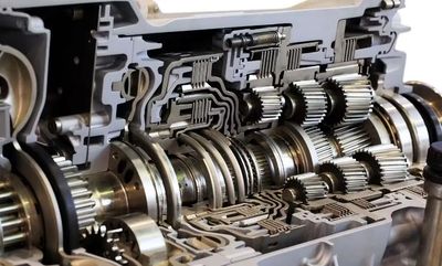 Cross-sectional view of a mechanical gearbox showing gears and shafts. manual transmission services Van Nuys