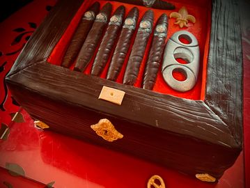 Cigar box Grooms cake with chocolate cigars.