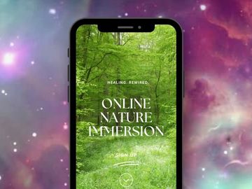 A phone with a forest background, being held up in a room that looks like a galaxy.