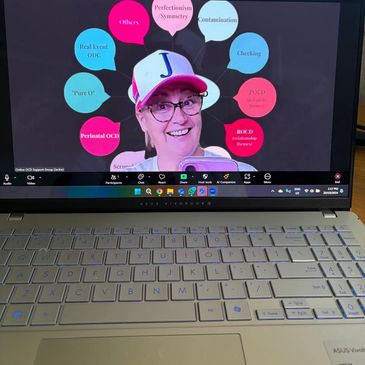 Person presenting an OCD-related topic on a laptop screen.