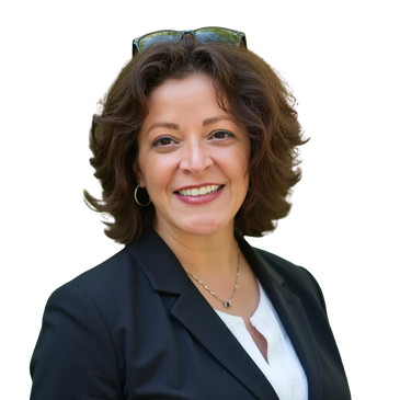 Smiling woman in business attire with glasses on her head.