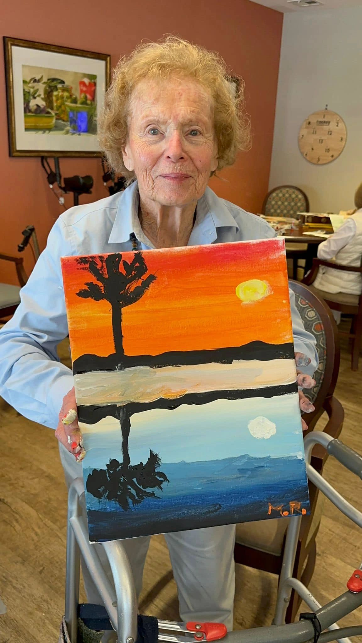 paint workshop participant showing painting.