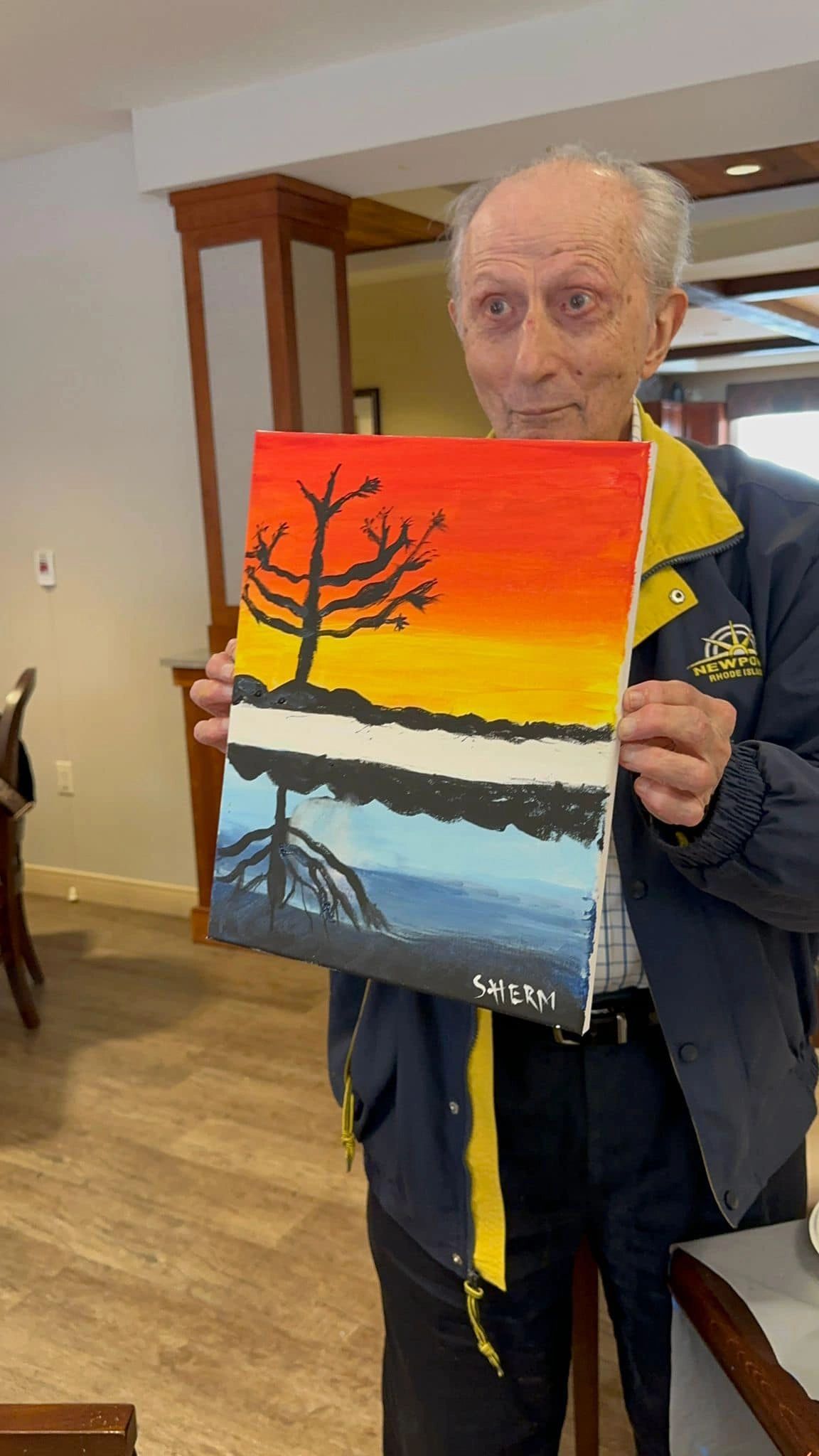 paint workshop participant showing painting.