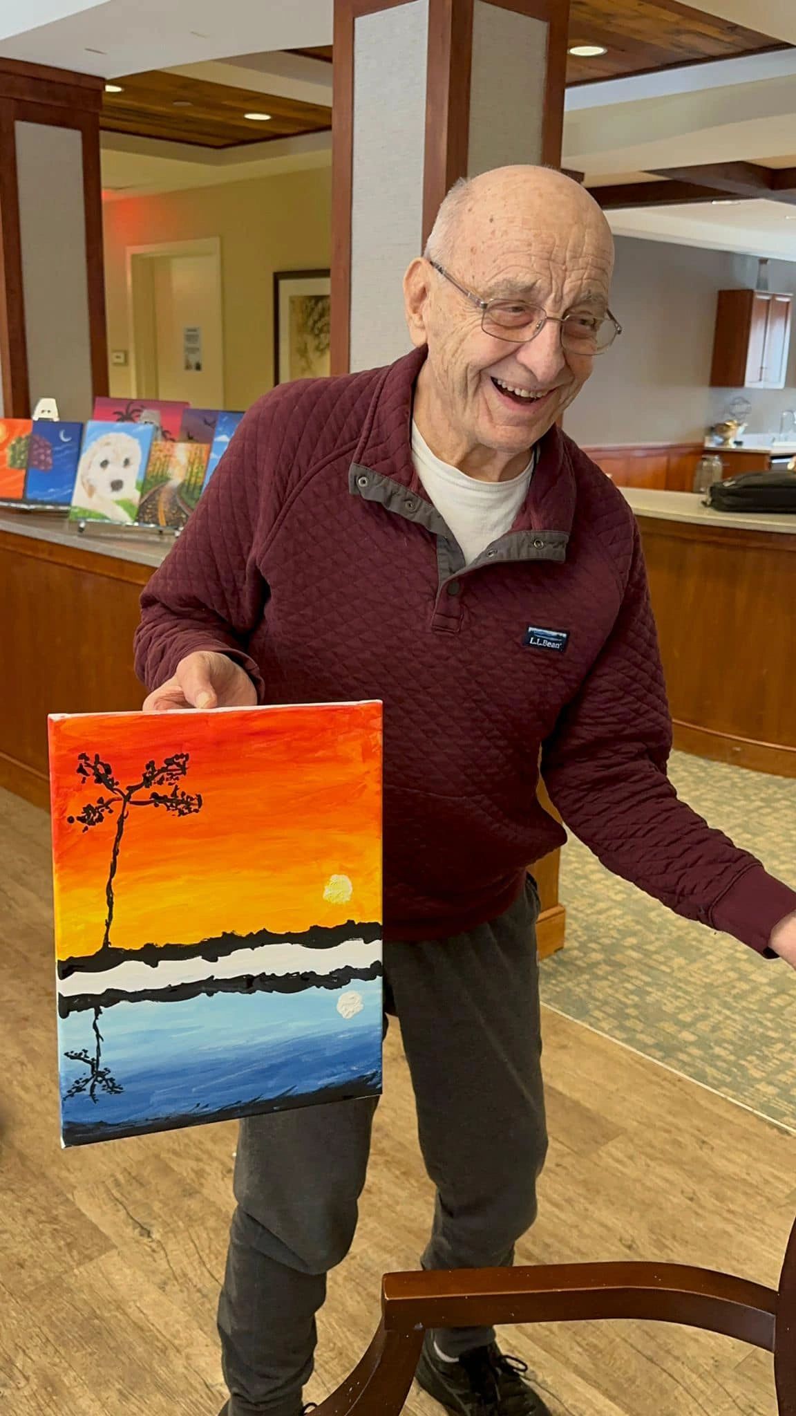 paint workshop participant showing painting.