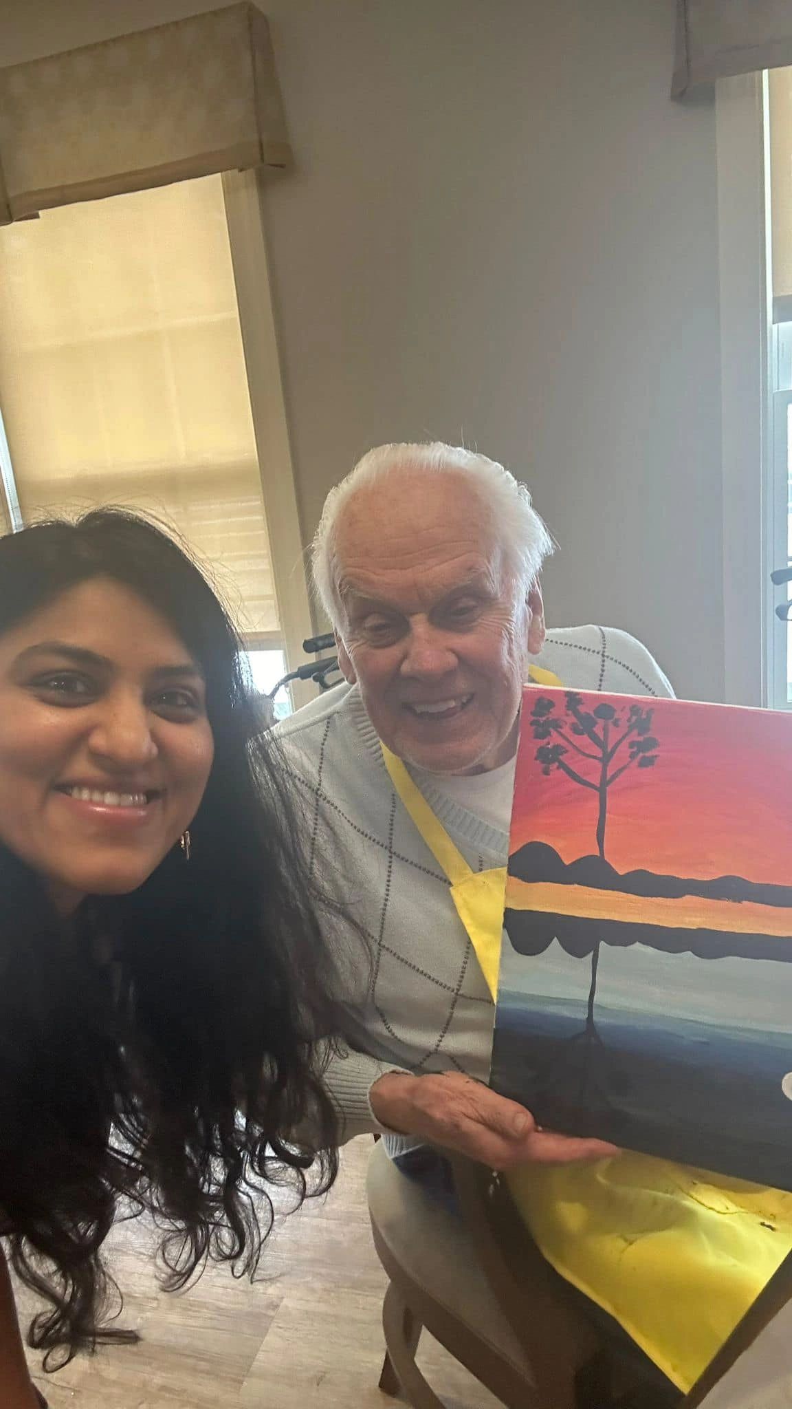 paint workshop participant showing painting.
