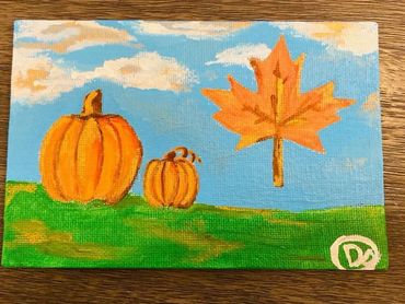 Handmade  by Children Thanksgiving Pumpkins and Leaf in Field