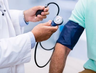 Patient having blood pressure taken