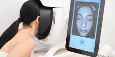 lade with her face in the skin analysewr getting a report of the skin problems ready for tailored tr
