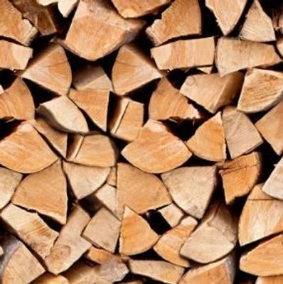 Stacked firewood logs neatly arranged.