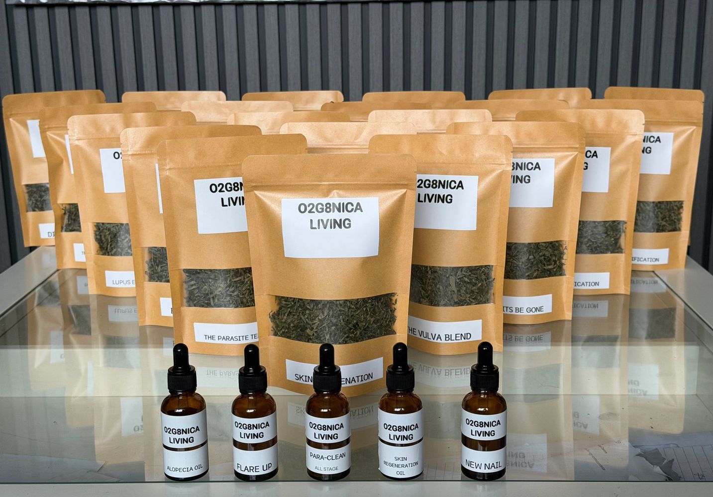 Stack of books next to pencils in a holder and a camera.