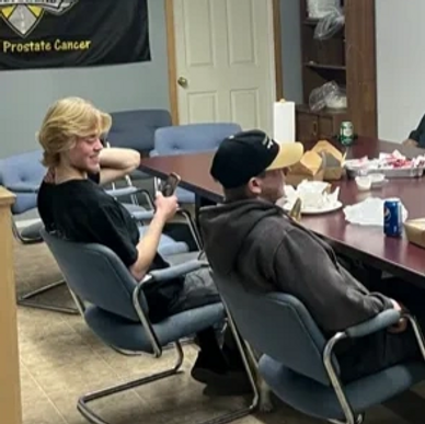 Jake and Roman Enns in the board rooms of Gills Truck and Auto.