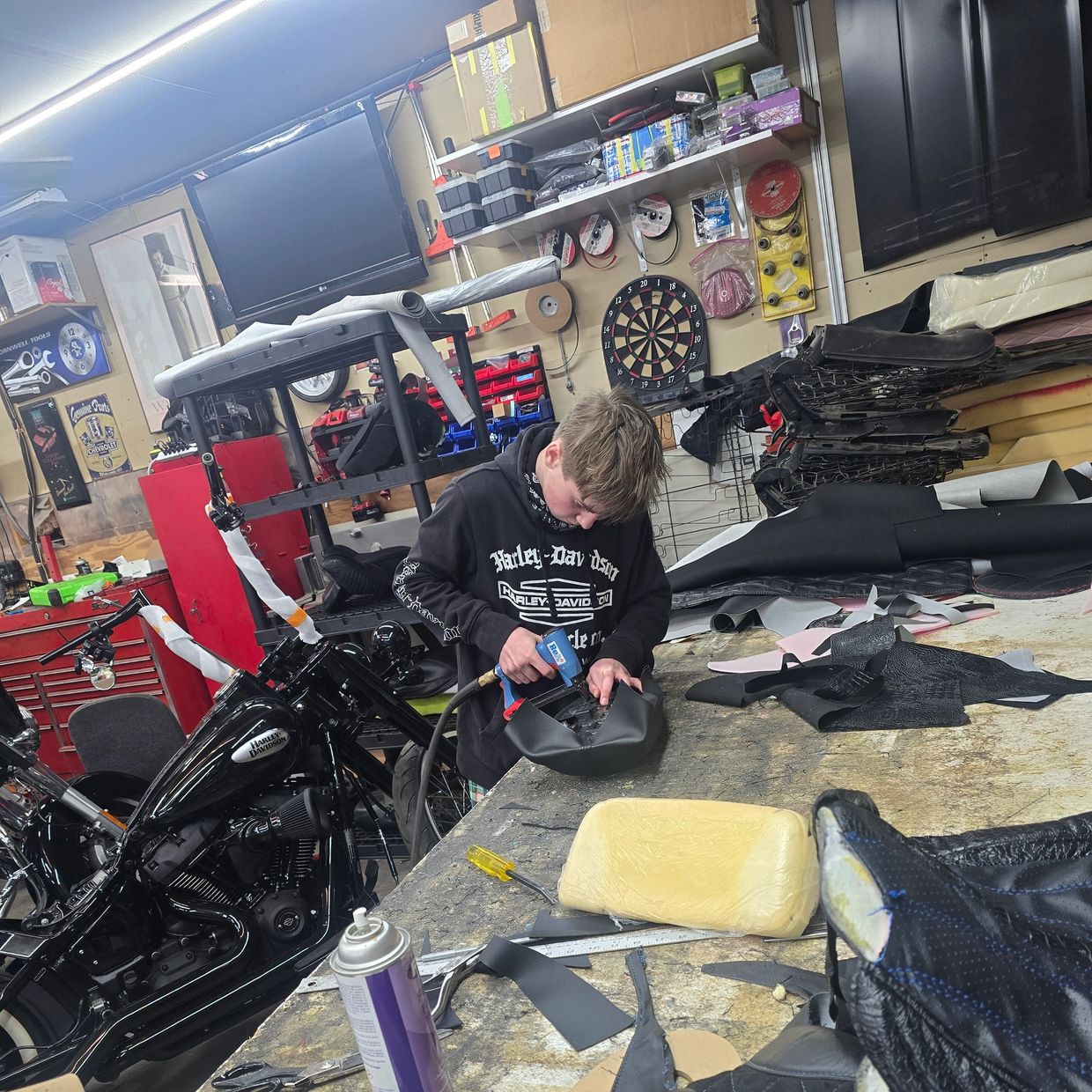 K-Dog Stapling a seat cover on.