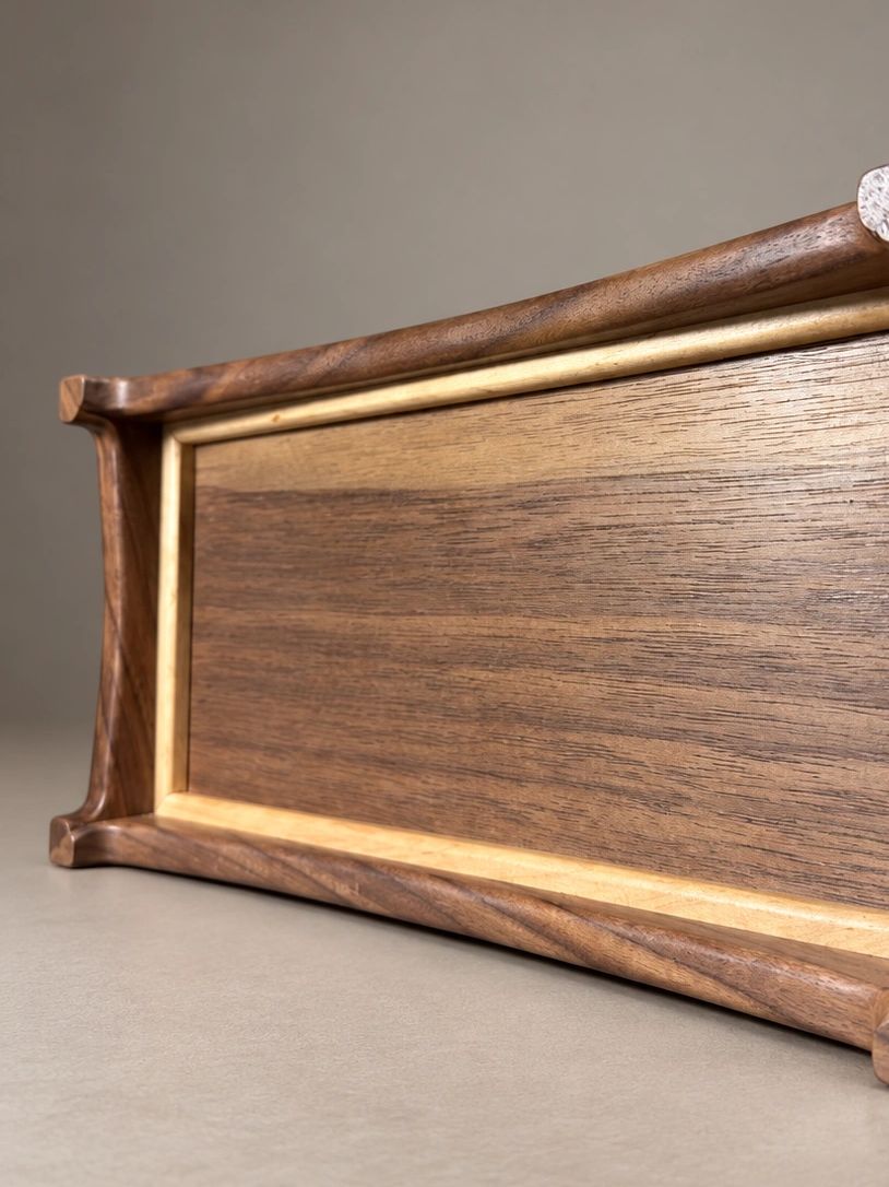 Handcrafted wooden box with smooth finish and elegant edges.